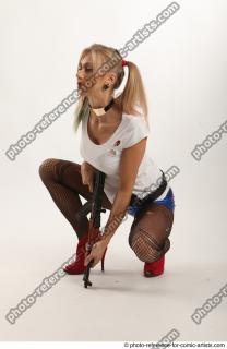 02 2018 01 NIKOL SQUATTING POSE WITH GUN